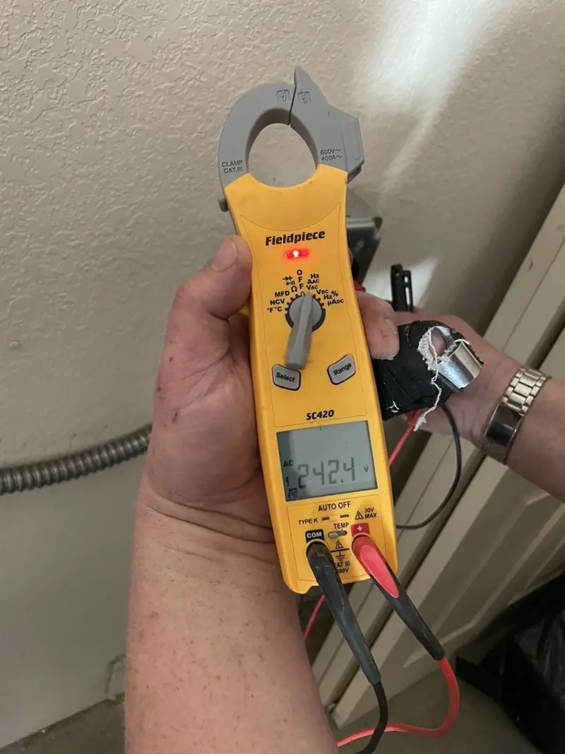Voltage testing with clamp meter during Generator Installation in Seabrook
